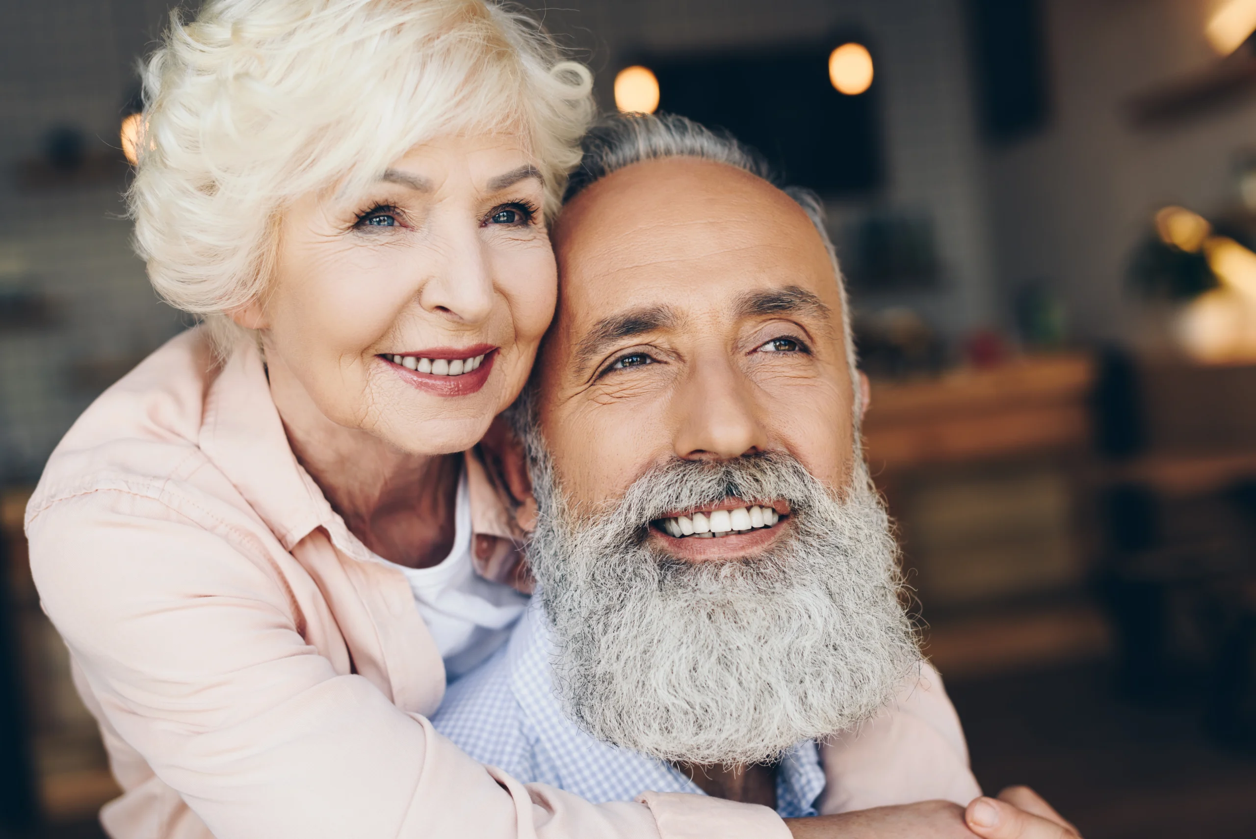 A patient smiling after dental implant treatment at Primadent, Liverpool